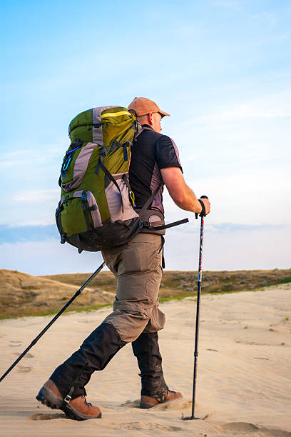 istock Man With Backpack Hiking In The Desert 480750992