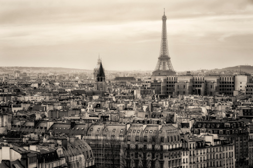 Paris, France - 1983: A vintage 1980's Fujifilm negative film scan of Notre Dame de Paris cathedral on a clear blue sky day.
