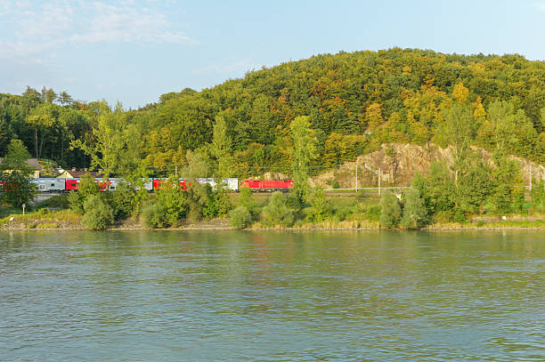 train by danube river near grein austria train by danube river near grein austria grein austria stock pictures, royalty-free photos & images