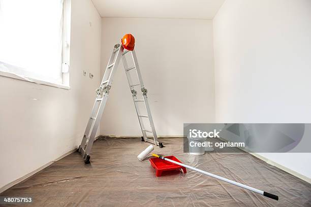 Painting Tools In An Empty Room Prepared For Renovation Stock Photo - Download Image Now