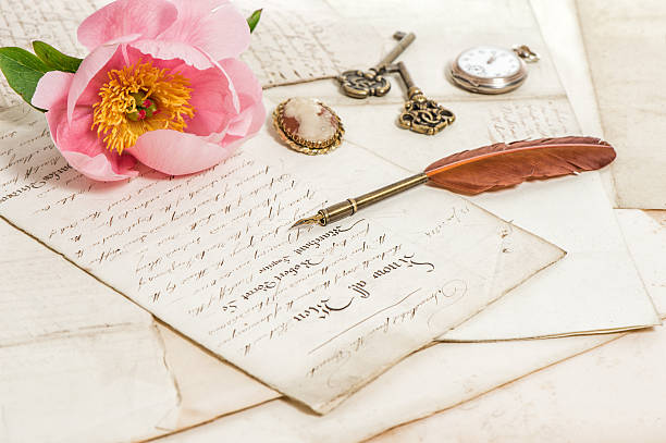 istock Old letters, pink peony flower and antique feather pen. 480757588