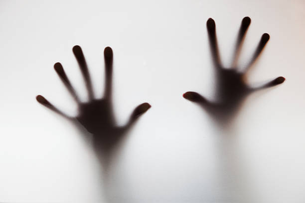 istock Hands touching frosted glass. Conceptual scream for help 480757683