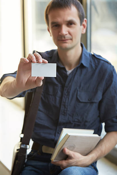 istock businessman giving a business card 480757768