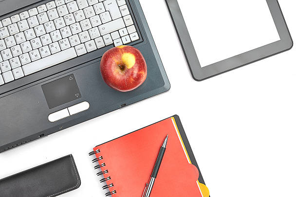 istock Laptop and office supplies on white 480757823
