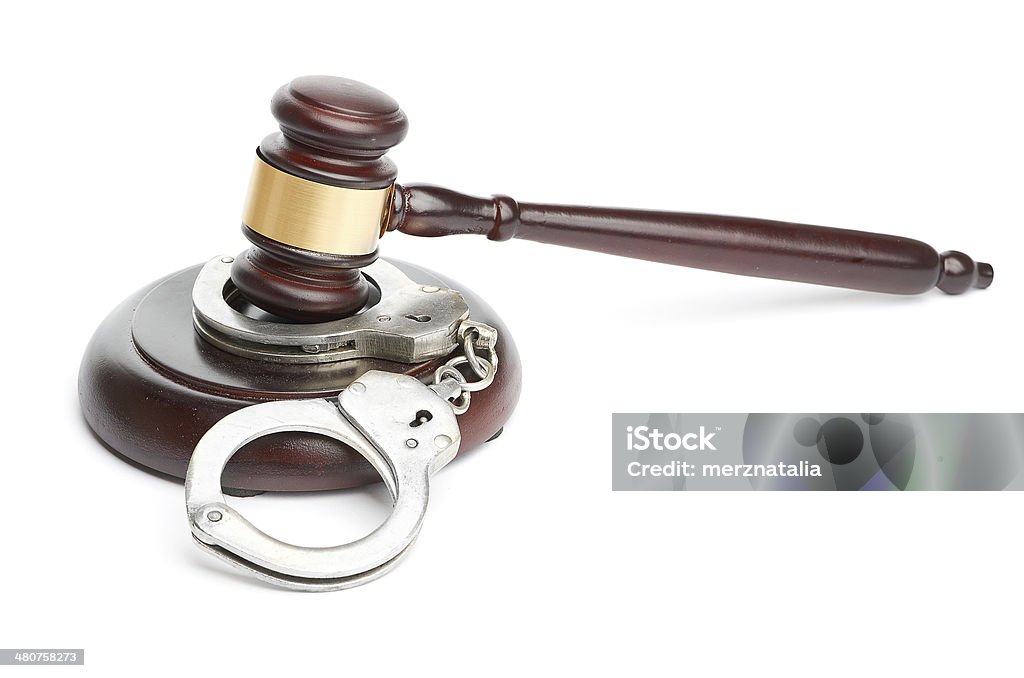 handcuffs and gavel Arrest Stock Photo