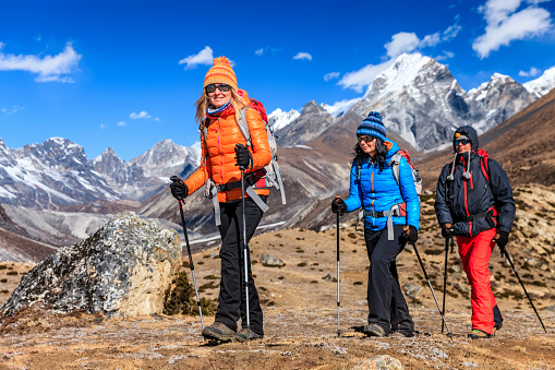 Group of 3 trekkers in Mount Everest National Park. This is the highest national park in the world, with the entire park located above 3,000 m ( 9,700 ft). This park includes three peaks higher than 8,000 m, including Mt Everest. Therefore, most of the park area is very rugged and steep, with its terrain cut by deep rivers and glaciers. Unlike other parks in the plain areas, this park can be divided into four climate zones because of the rising altitude. The climatic zones include a forested lower zone, a zone of alpine scrub, the upper alpine zone which includes upper limit of vegetation growth, and the Arctic zone where no plants can grow. The types of plants and animals that are found in the park depend on the altitude.http://bem.2be.pl/IS/nepal_380.jpg