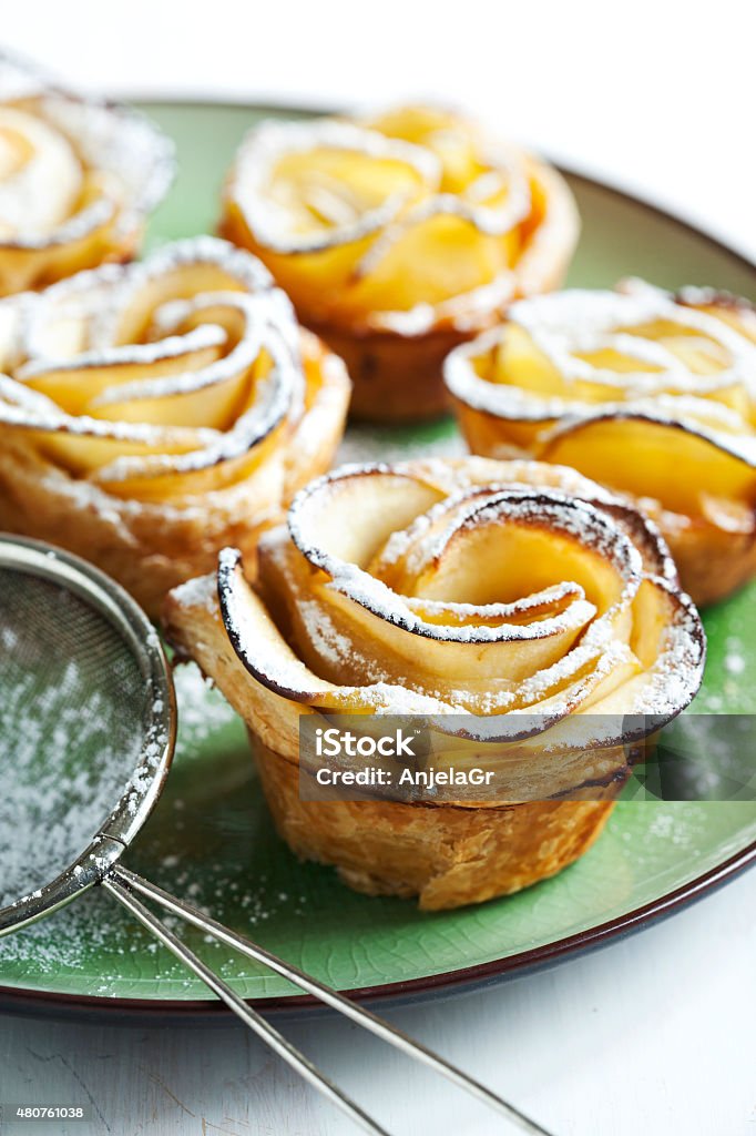 Apple Roses Cakes Apple roses. Cakes Apple Roses made from puff pastry with apple and cinnamon. 2015 Stock Photo