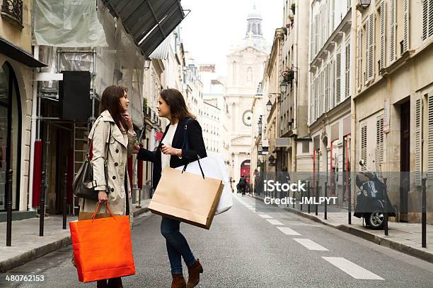 Two Young Women Discussing In The Middle Of The Street Stock Photo - Download Image Now