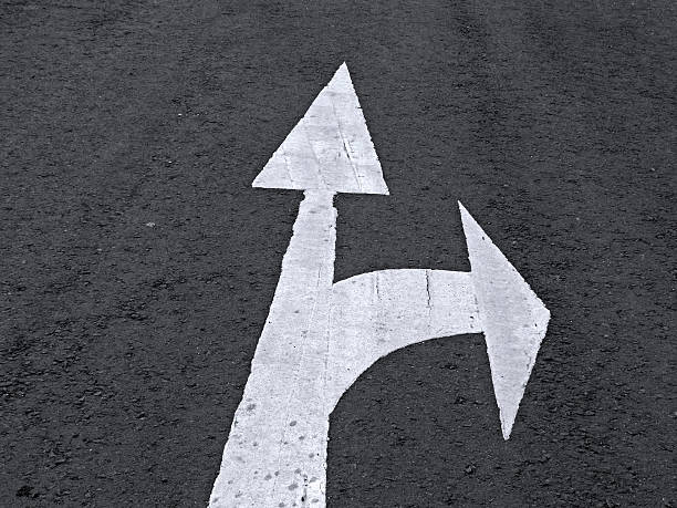 istock Arrows are marked on a highway to show direction 480762745