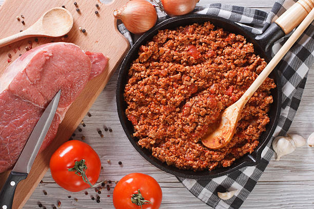 istock Bolognese sauce cooking in a frying pan horizontal top view 480769148