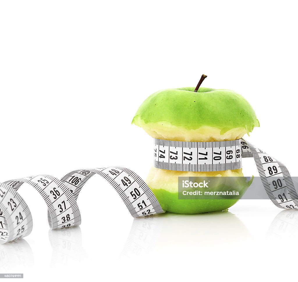 white measuring tape and apple Backgrounds Stock Photo