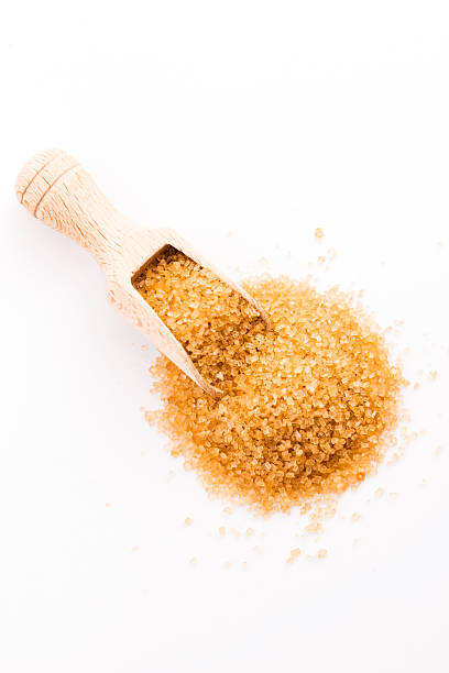 istock Crystals cane sugar heap close up isolated on white 480769238