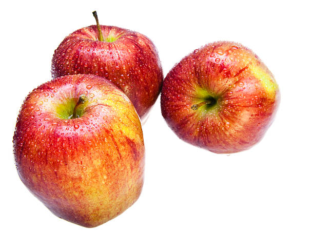 istock Three juicy apples lay  on white background 480771740
