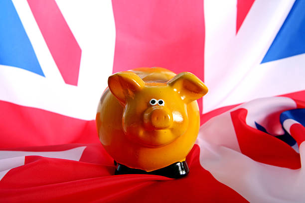 istock flag UK with piggy bank 480773709
