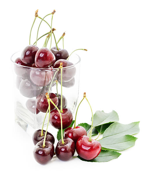istock Cherries, leaves and glass. 480775242