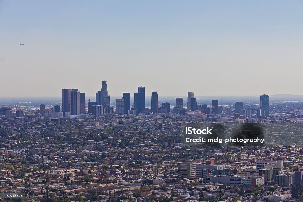 The city of Angels A view of the skyline of Downtown Los Angeles and the surrounding area from the Griffith Observatory in a sunny spring day. 2015 Stock Photo