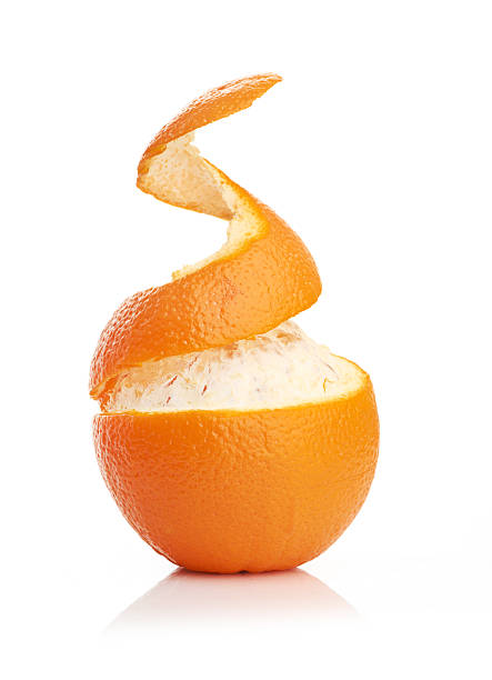 istock orange with peeled spiral skin 480776261