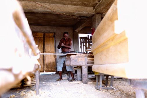Coffin maker working in his workshop