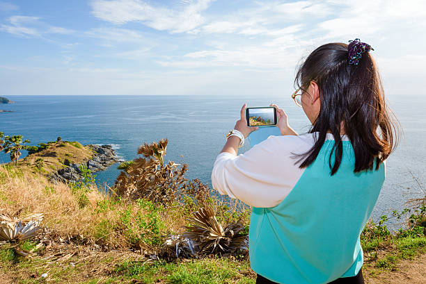 istock Woman taking photograph with smartphone 480779894
