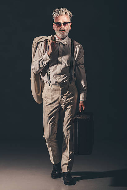 istock Stylish Senior Man Holding his Coat and Suitcase 480780070
