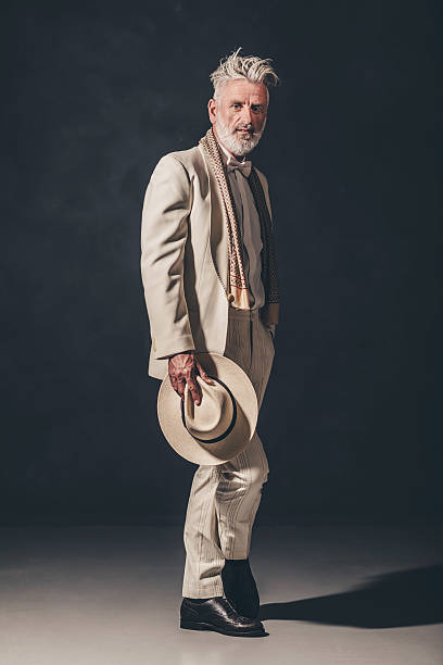 istock Thoughtful Elegant Senior Guy Against Black Wall 480780092