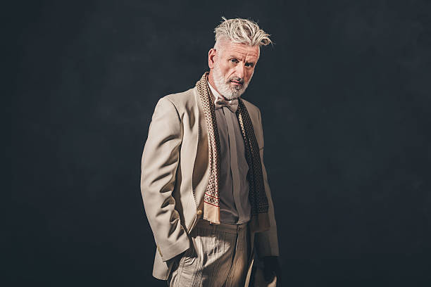 istock Fashionable Senior Bearded Man Against Black Wall 480780096