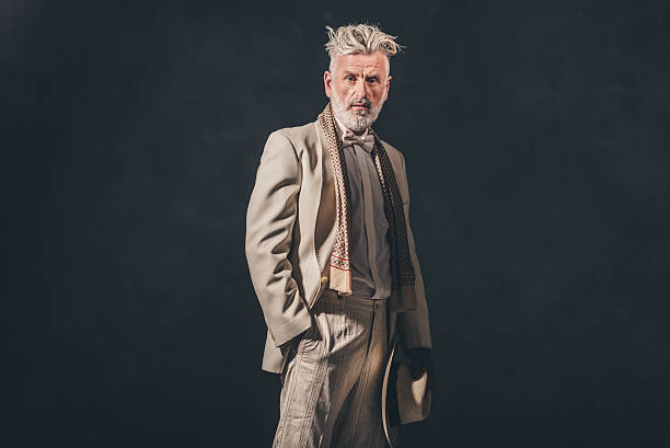 istock Fashionable Senior Bearded Man Against Black Wall 480780098