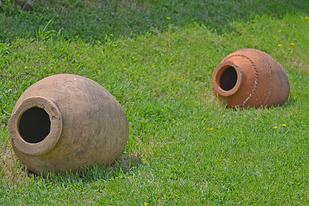 istock Clay jug on the green grass, Georgia 480780540