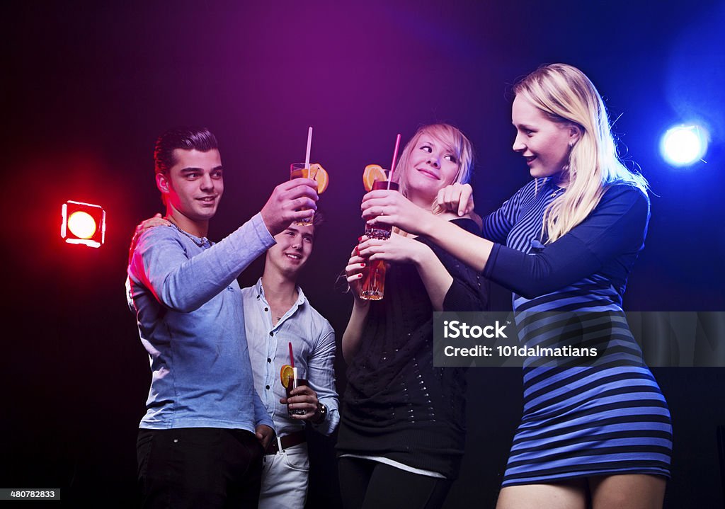 Group of young friends in nightclub Group of young friends having fun in nightclub.They are toasting with glasses 20-29 Years Stock Photo