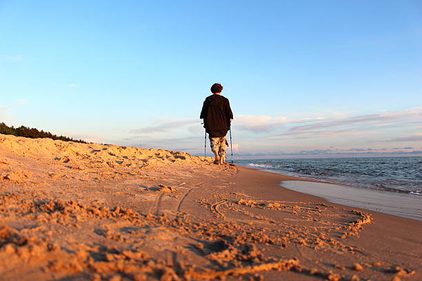 istock Nordic walking on the beach, woman hiking 480782862