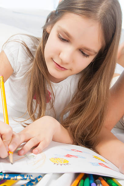 istock Little caucasian girl drawing 480782915