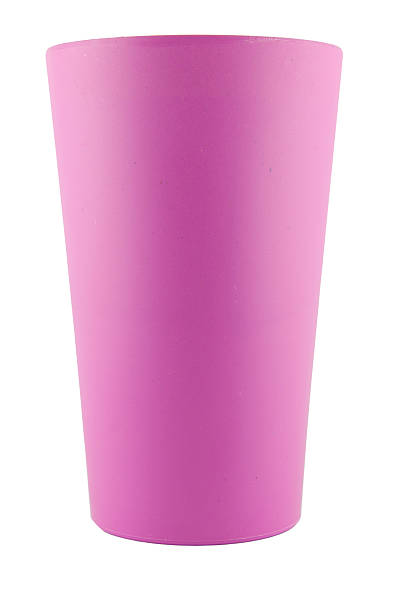 istock Pink plastic glass on white background 480783173