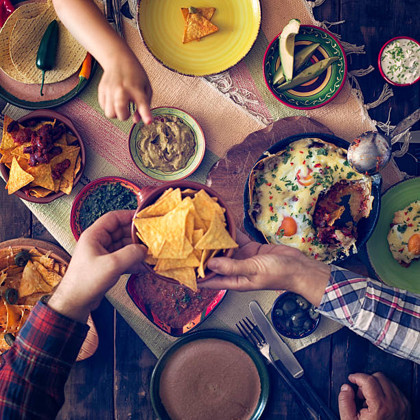 istock Eating Mexican Eggs and Tortilla Chips with Salsa and Jalapenos 480783420