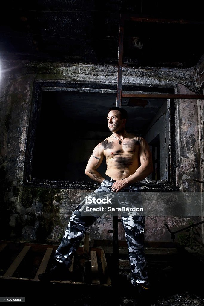 Strong soldier Young well built man Abandoned Stock Photo