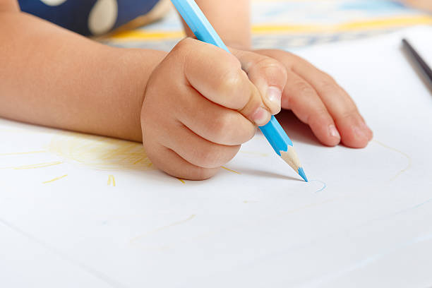 istock Adorable little girl drawing with pencils 480785648