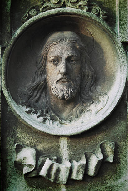 istock Jesus Christ on a ancient tomb (statue) 480786072