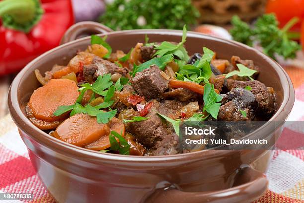 Stew With Beef Vegetables And Prunes In A Saucepan Closeup Stock Photo - Download Image Now