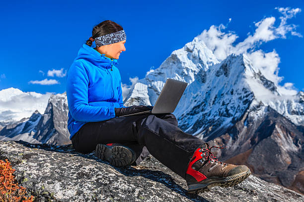 istock Woman is using laptop in Mount Everest National Park, Nepal 480788513
