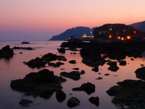 view of rocky coast during sunset in busan, south korea