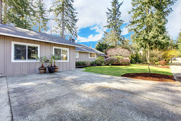 istock Brown grey house exterior with large driveway. 480789887
