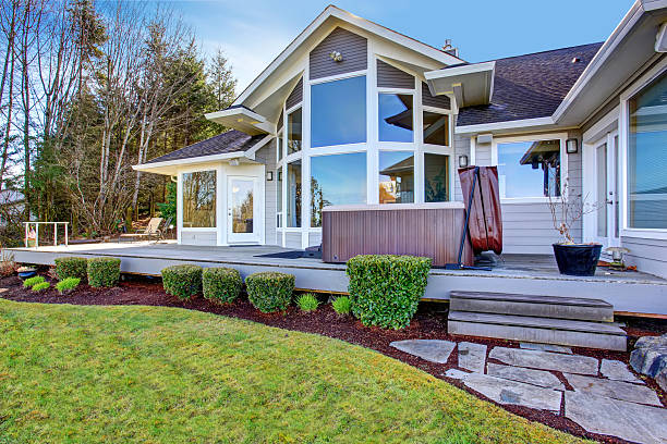 istock Traditional back deck with tall windows, and hot tub tub. 480794298