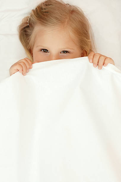 istock Adorable little girl under the blanket 480794908