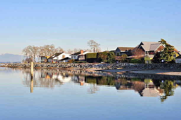istock Houses reflecting on the water in Mud Bay 480797258
