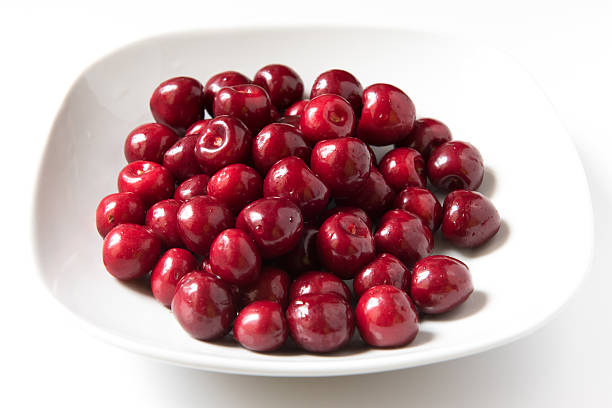istock Bowl of red fresh cerries on a white background 480797898