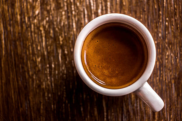 istock cup of coffee on wood table with copy space. 480798627