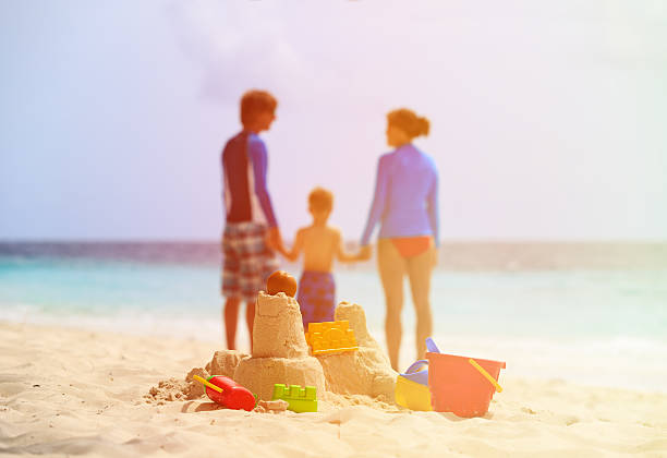 istock sand castle on tropical beach, family vacation 480801148