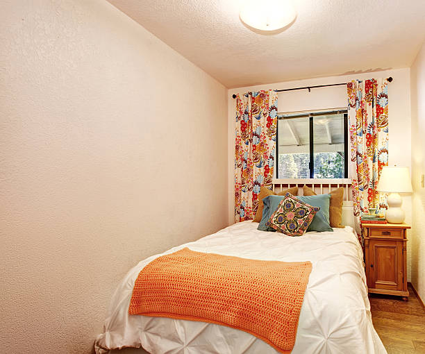 istock small bedroom with nice bedding and hardwood floor. 480802538