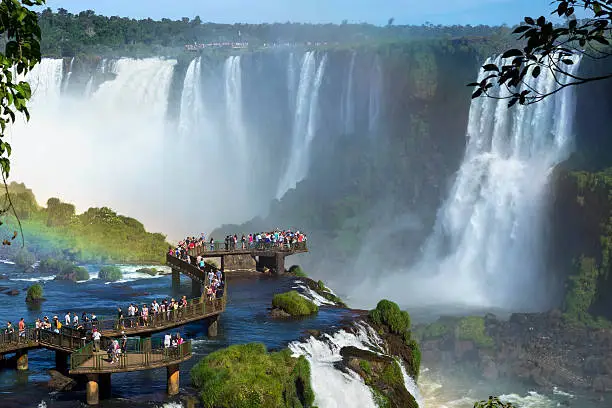 Tourists at Iguazu Falls, one of the world's great natural wonders, near the border of Argentina and Brazil.