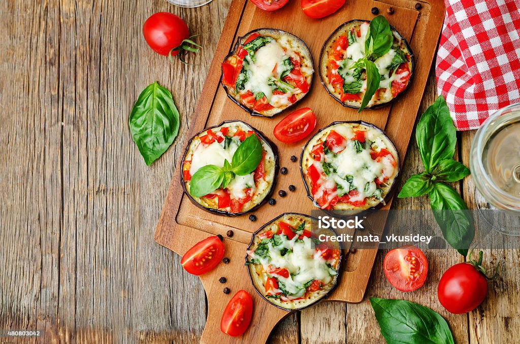 pizza eggplant with tomatoes and Basil pizza eggplant with tomatoes and Basil. the toning. selective focus Eggplant Stock Photo