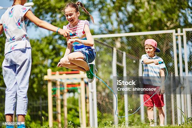 Happy Jumping Stock Photo - Download Image Now - Jump Rope, Child, Boys